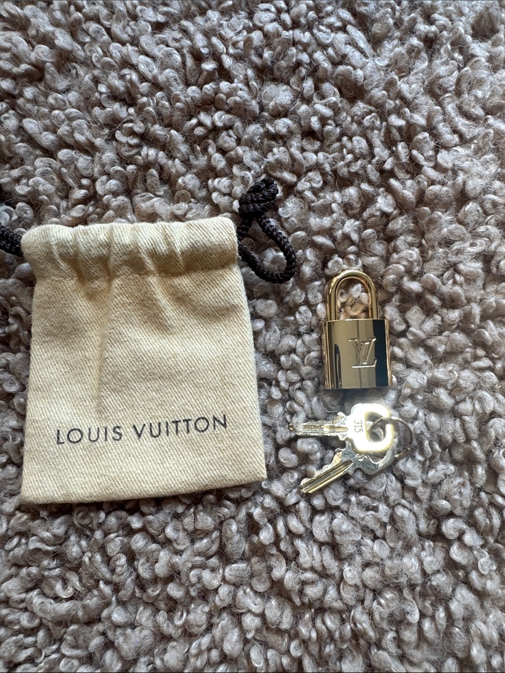Louis Vuitton Gold-Tone Padlock and Keys with Beige Drawstring Pouch